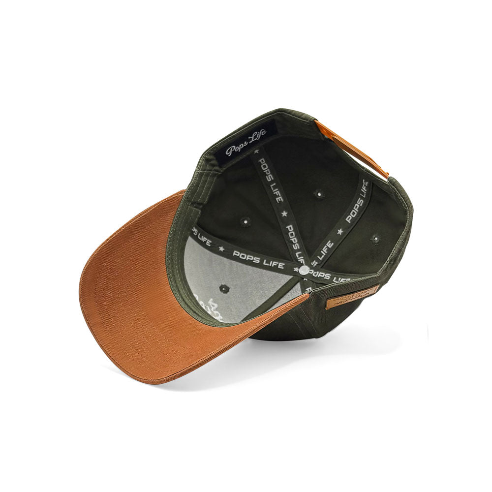Interior view of Pops Life green and tan dad hat showing branded taping and structured crown.