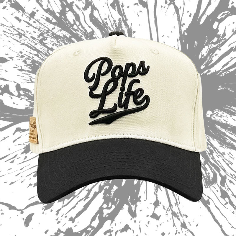 Front view of Pops Life A-Frame dad hat with artistic background, emphasizing designer style.