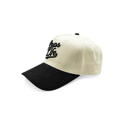 Side view of Pops Life A-Frame dad hat in black and tan, highlighting high-quality stitching.