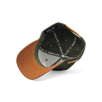 Interior view of Pops Life green and tan dad hat showing branded taping and structured crown.