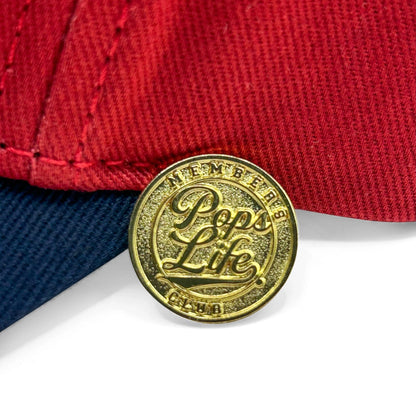 Gold 'Pops Life' coin on a Pops Life Maroon and Navy Dad Hat